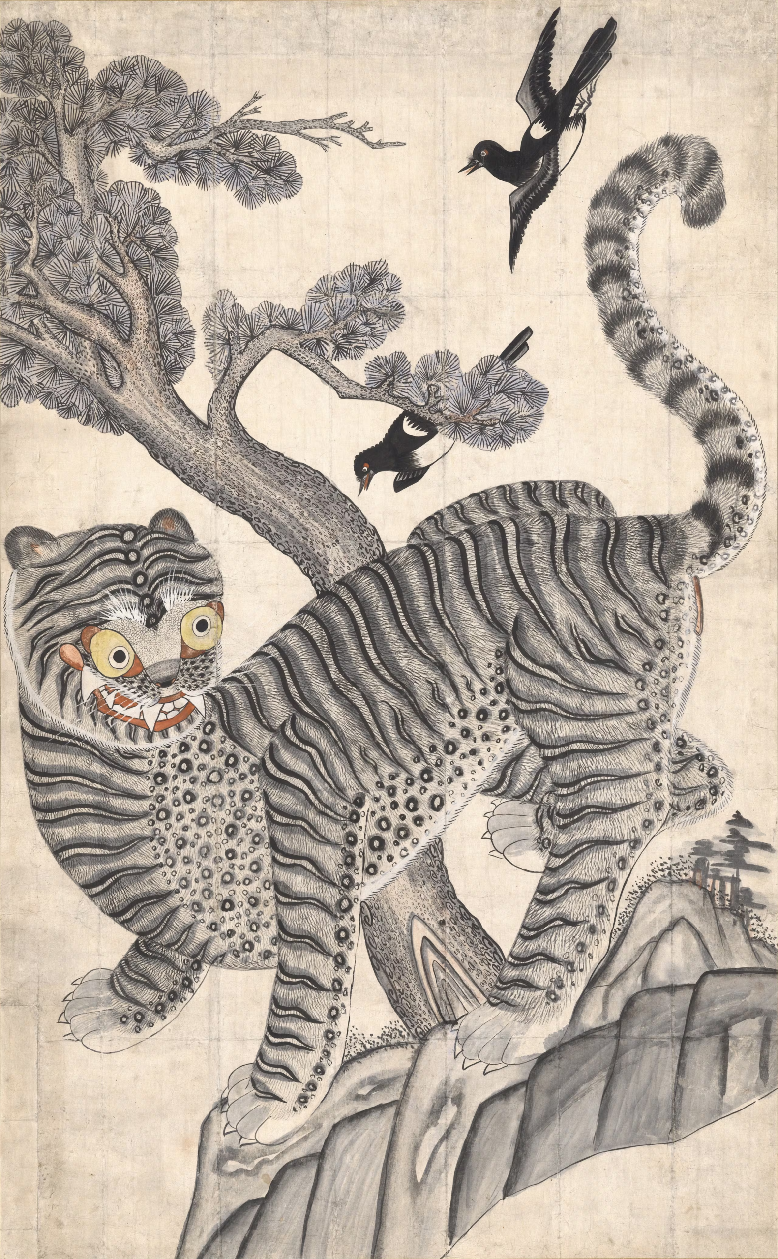 A wide-eyed striped tiger with a raised curling tail beneath two black-and-white magpies and a pine tree.